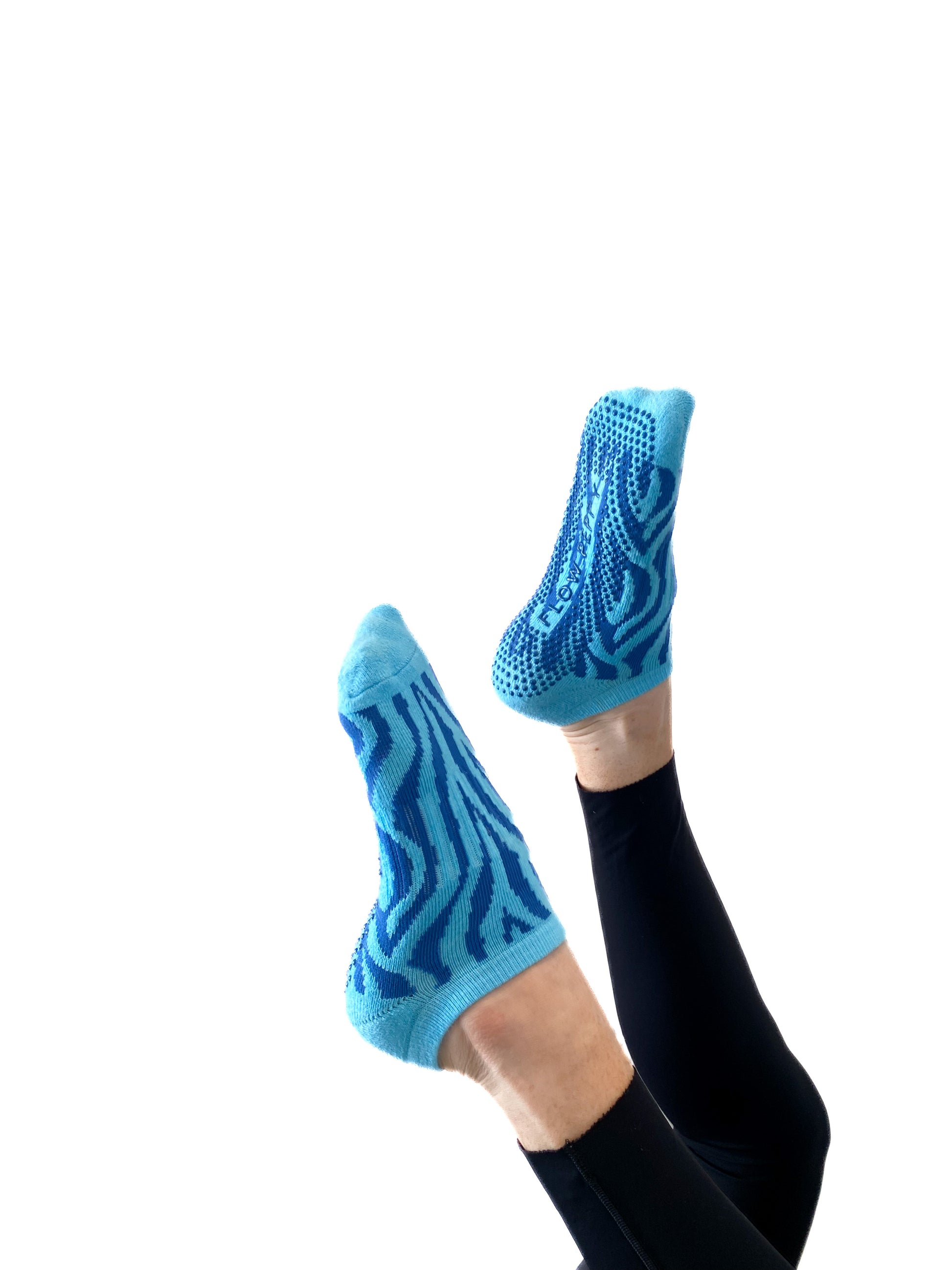 Blue pair of Flow Peppy, New Zealand made ankle pilates and yoga grip socks blue patterns.  