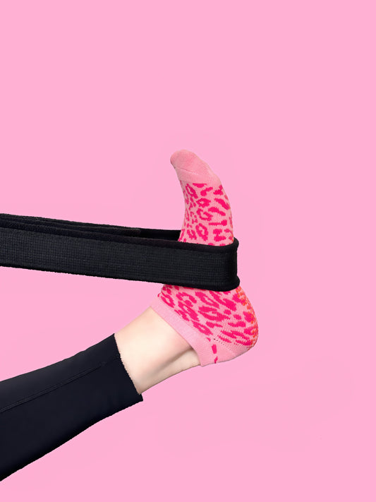 Pink cheetah Flow Peppy, made in New Zealand pilates and yoga ankle grip socks.