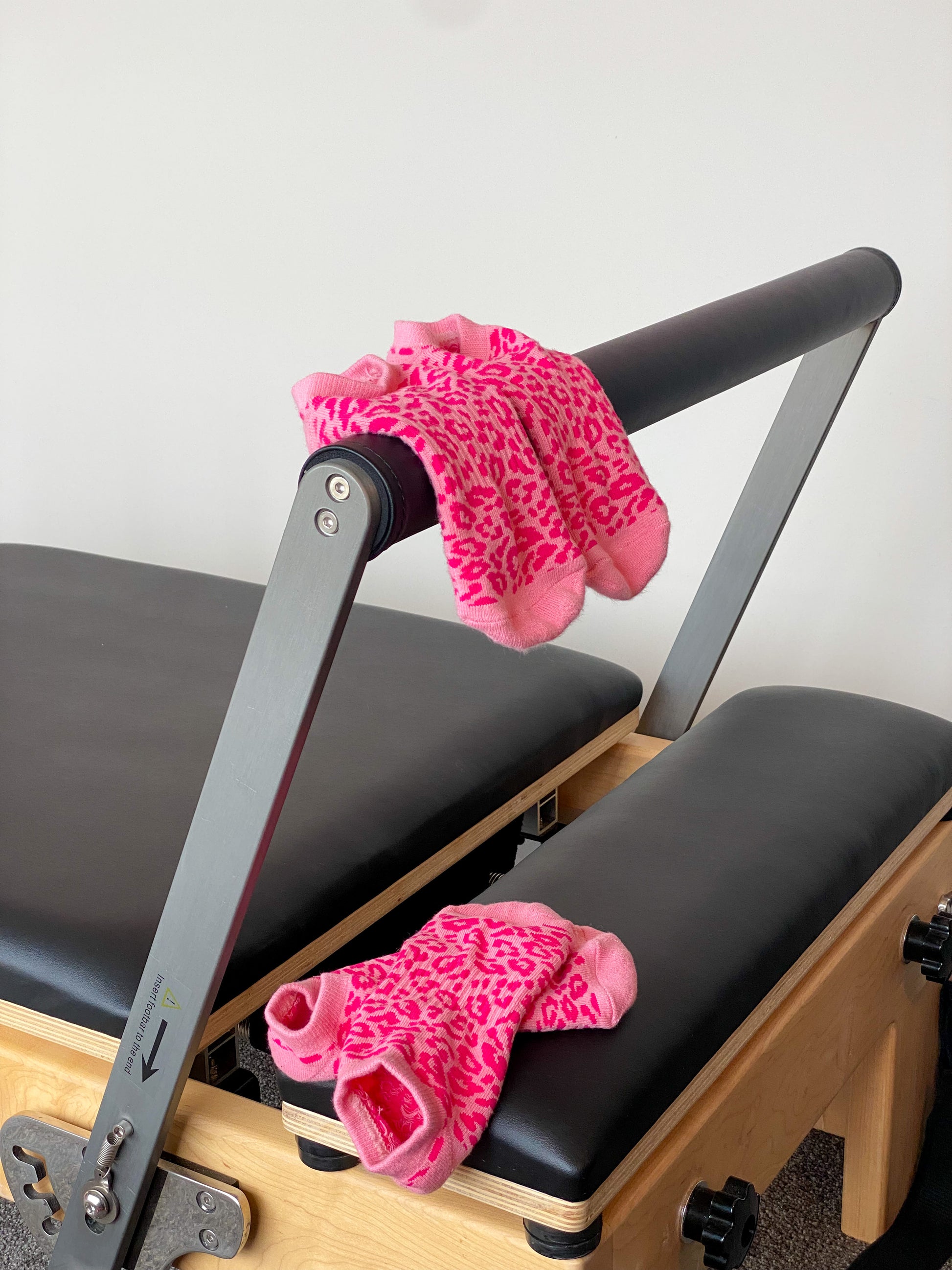 Pink cheetah Flow Peppy, made in New Zealand pilates and yoga ankle grip socks.