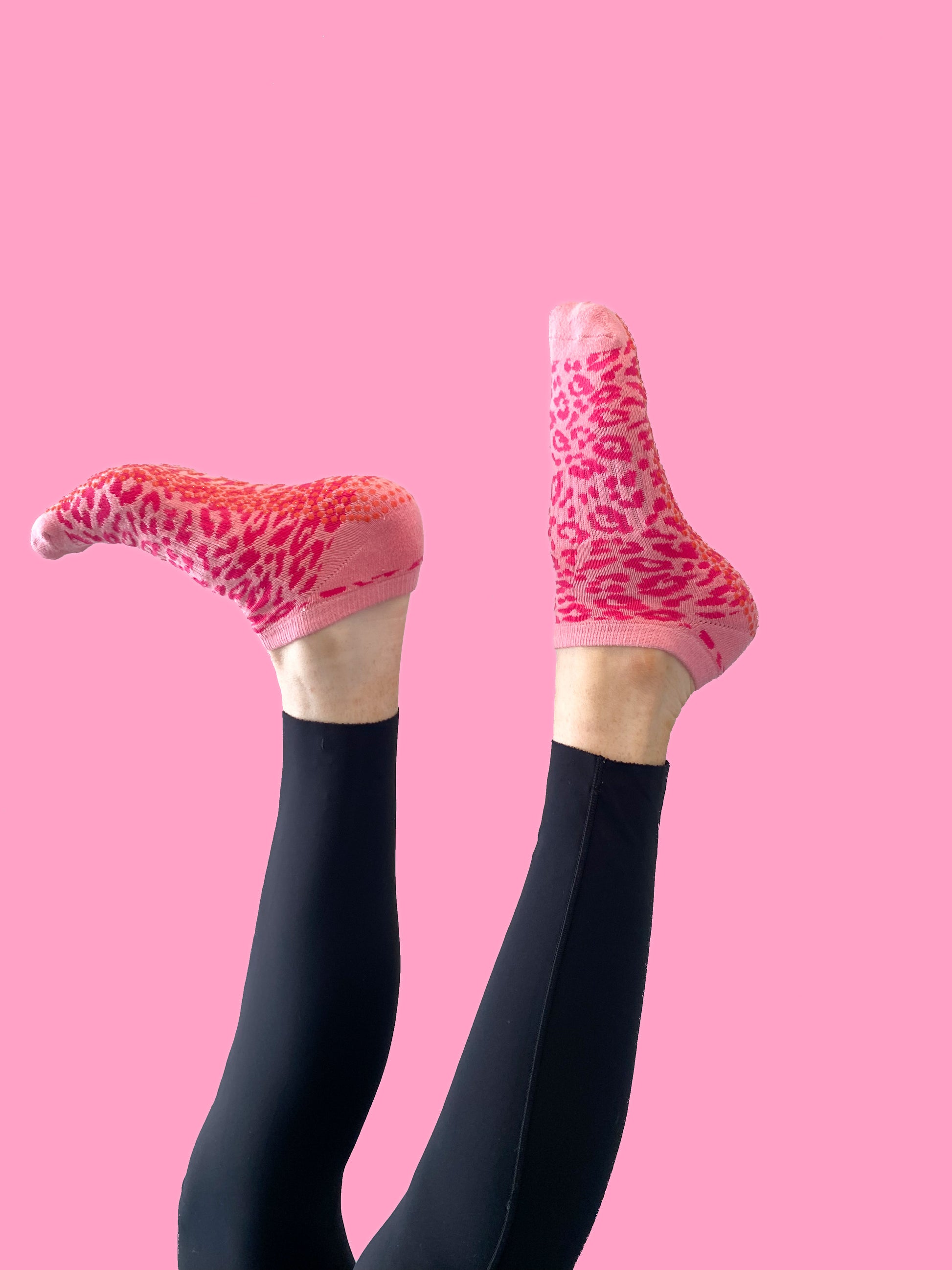 Pink cheetah Flow Peppy, made in New Zealand pilates and yoga ankle grip socks.