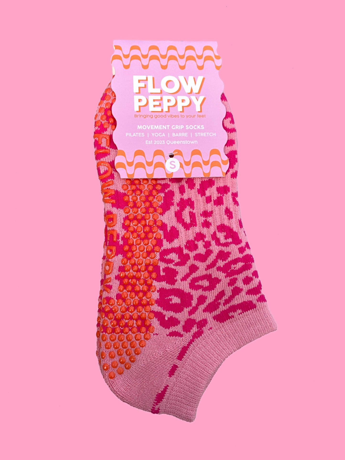 Pink cheetah Flow Peppy, made in New Zealand pilates and yoga ankle grip socks.