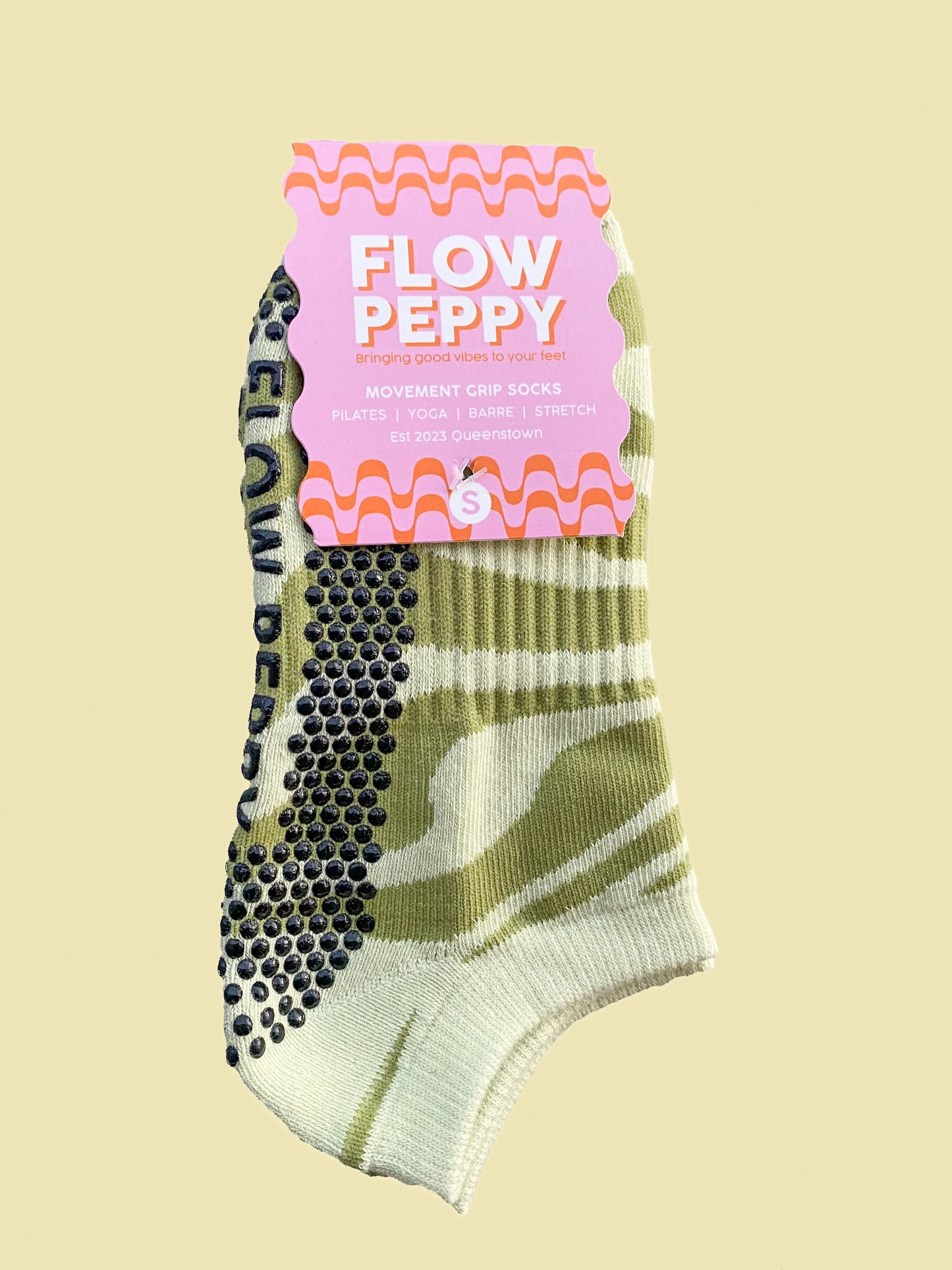 Green patterned Flow Peppy, New Zealand made pilates and yoga ankle grip socks. 